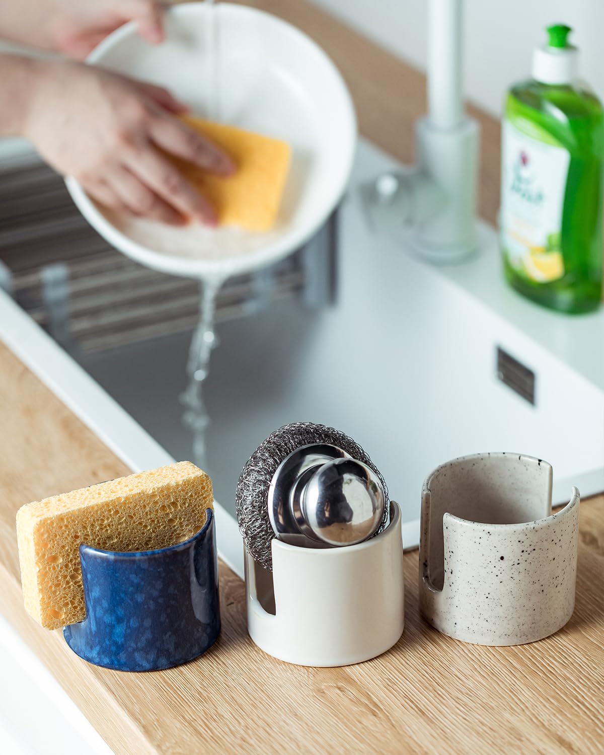 Zoeeker sponge holder on sink withstands daily use with a graceful glaze.