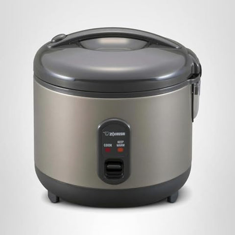 Zojirushi rice cooker metallic gray accessories including measuring cup and spatula.
