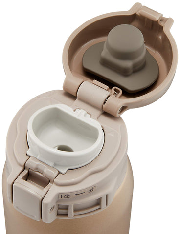 Zojirushi stainless mug beige gold lid release for practical use.
