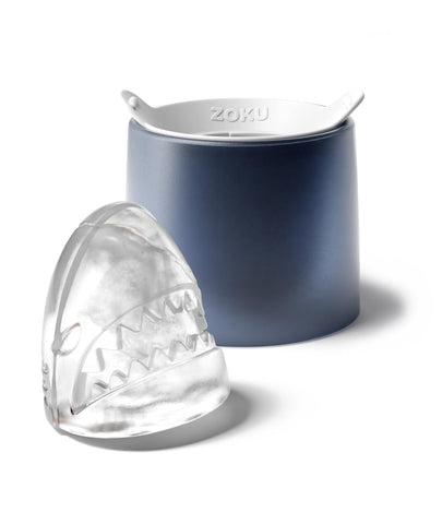 Cocktail glass with a shark ice ball enhancing presentation