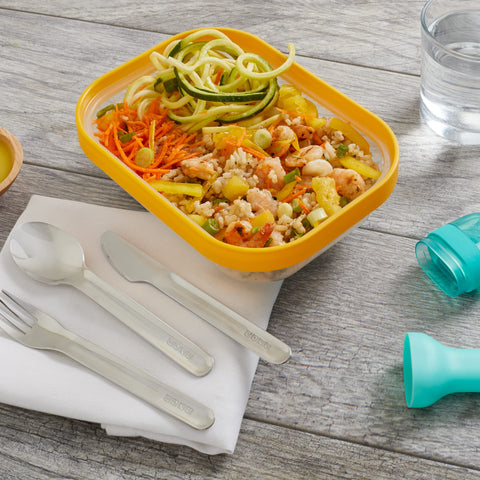 Teal ZOKU utensils in use at cafe for quick, eco-friendly dining.