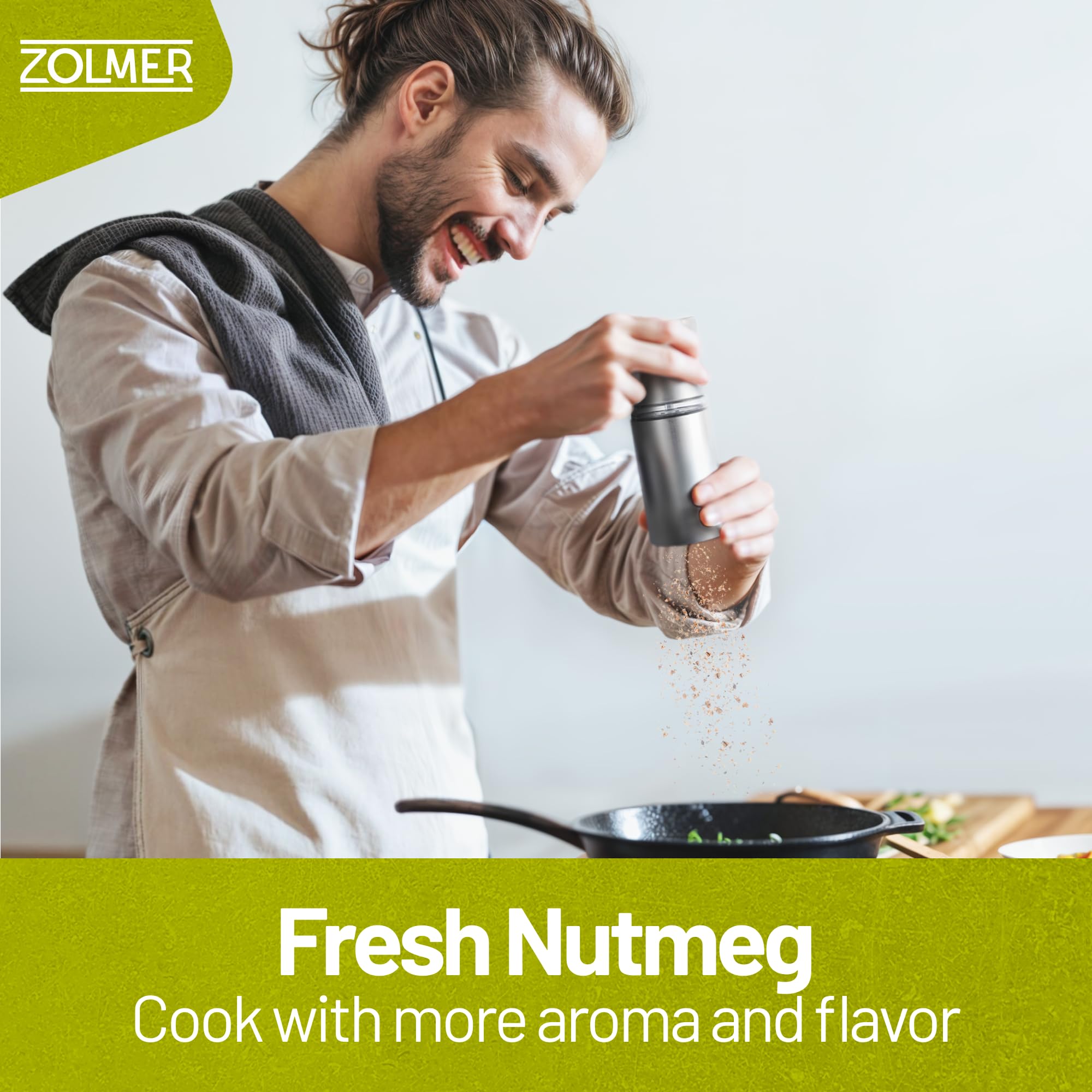 ZOLMER Nutmeg Grinder in use, grinding a fine powder.
