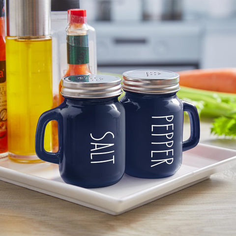 Close-up of glass shakers with stainless steel lids by ZOSUJO.