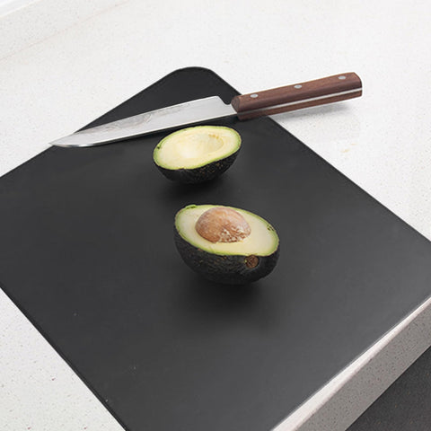 ZVP thick TPU cutting board folded for compact storage in a small kitchen.