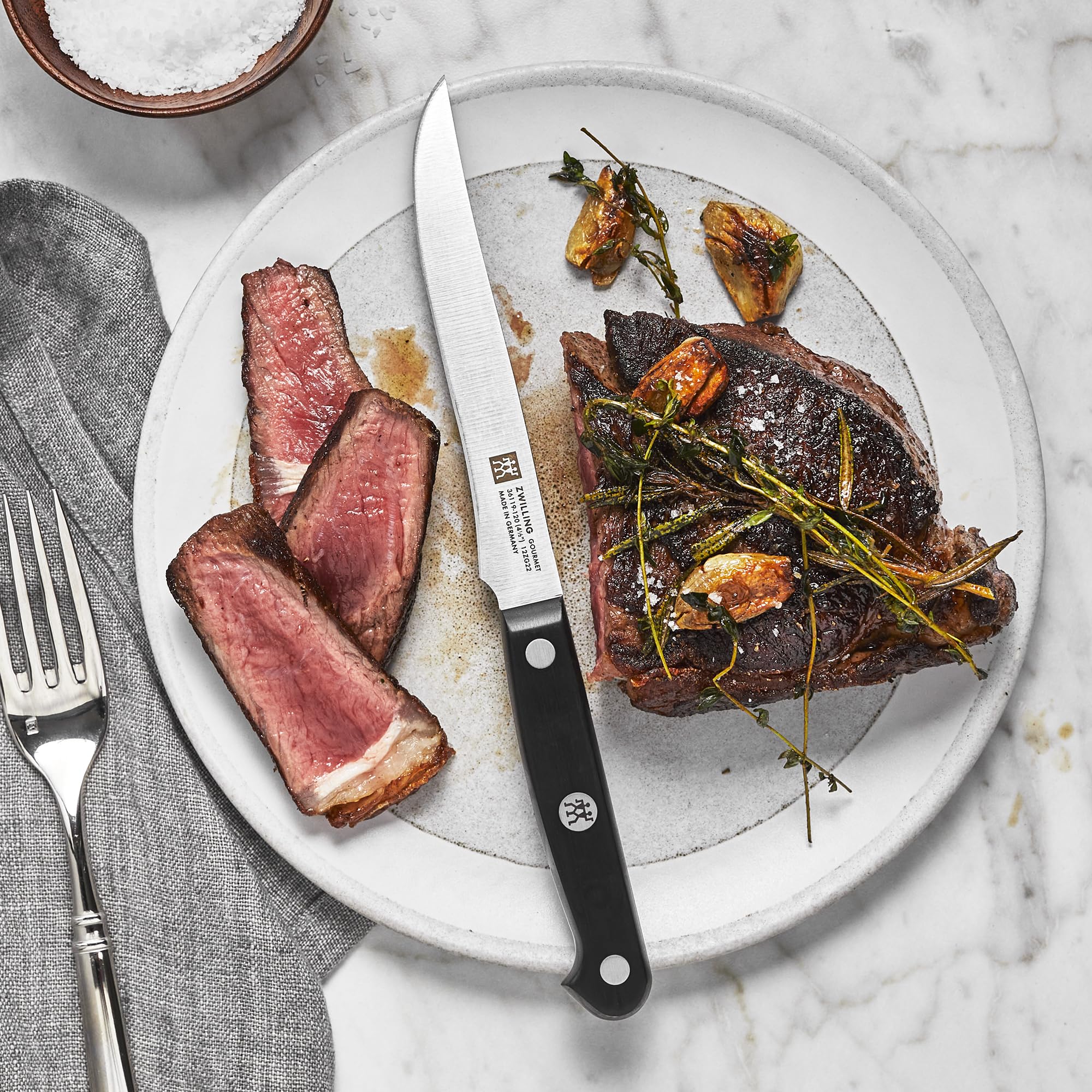 ZWILLING Gourmet ergonomic triple-riveted handle for fatigue-free cutting and comfort.