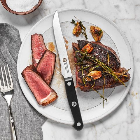 ZWILLING Gourmet ergonomic triple-riveted handle for fatigue-free cutting and comfort.
