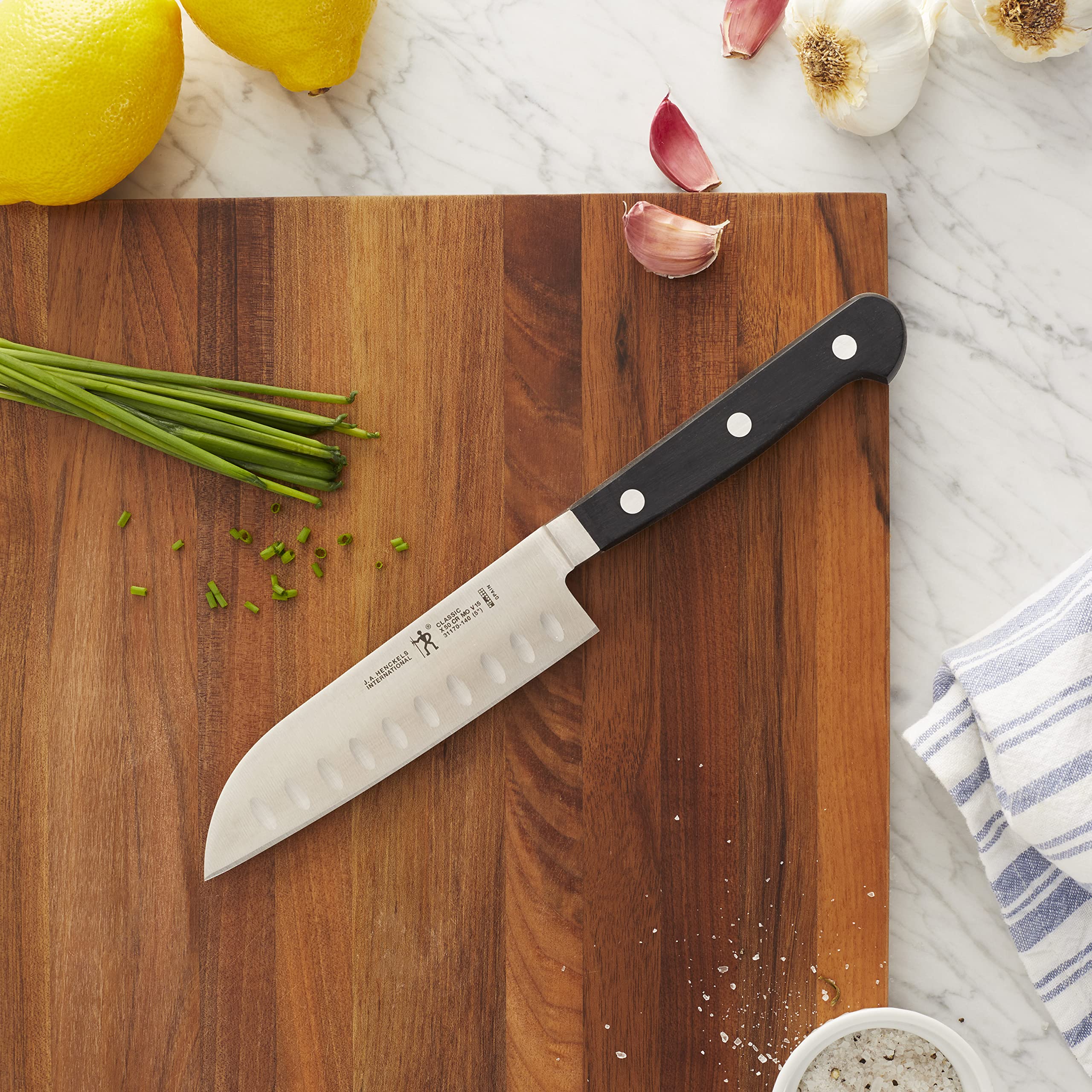 Zwilling Henckels Classic 5-inch Santoku ergonomic handle for balanced comfort during prep.