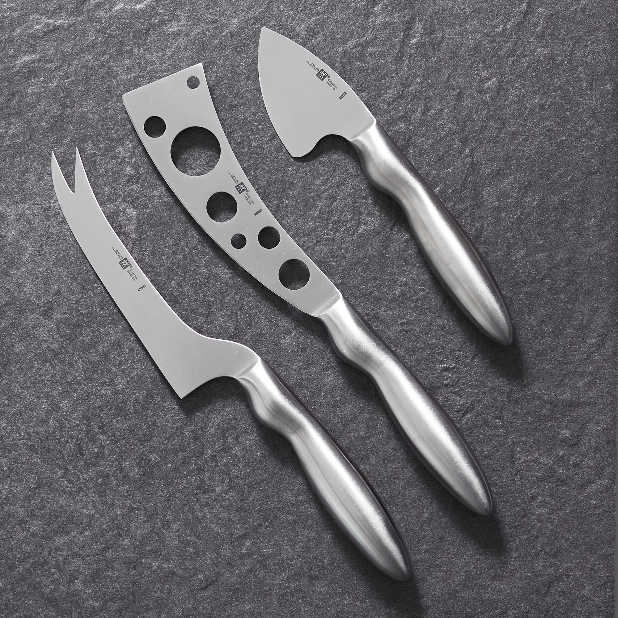 ZWILLING perforated knife five and a half inches aids semi-hard cheese slicing.