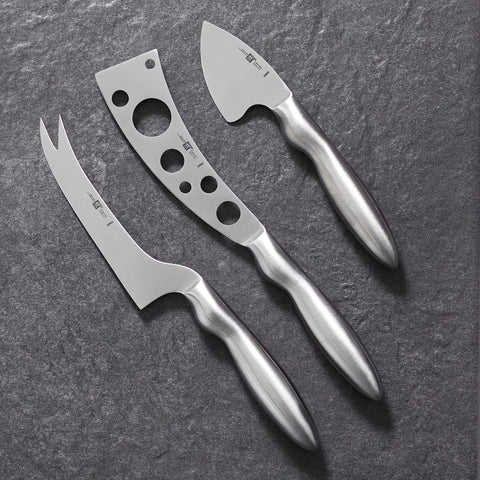ZWILLING perforated knife five and a half inches aids semi-hard cheese slicing.