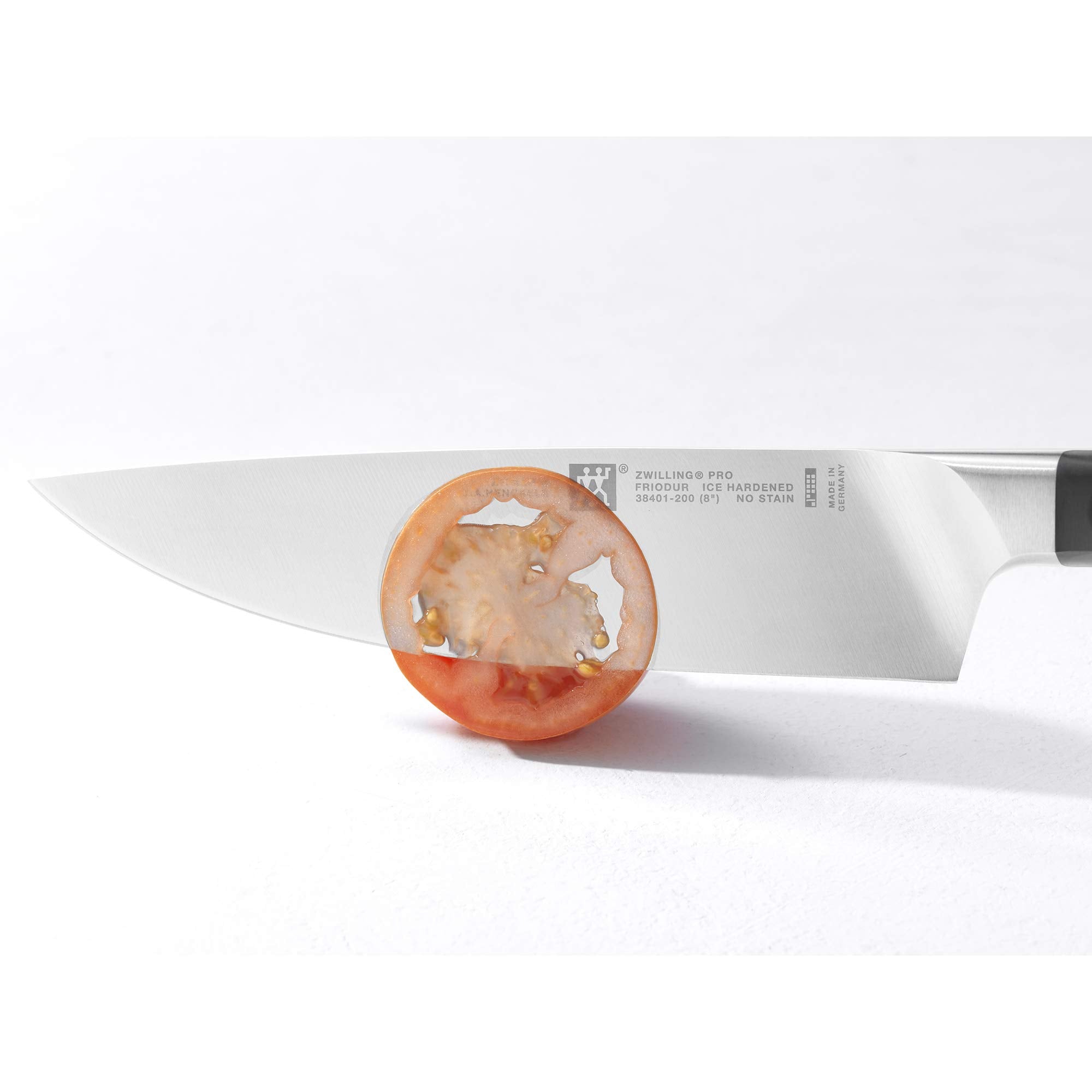 Zwilling Pro curved bolster highlights natural pinch grip for safer cutting.