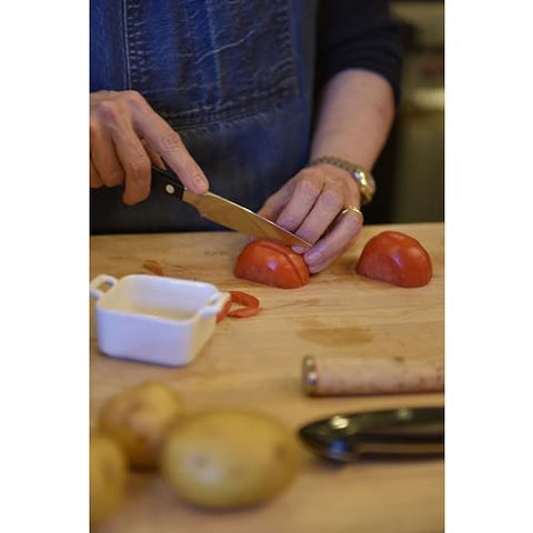 Zwilling Pro original paring knife on cutting board ready for precise trimming