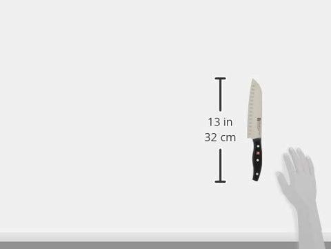 ZWILLING Twin Signature ergonomic handle; full tang for secure balance during slicing.