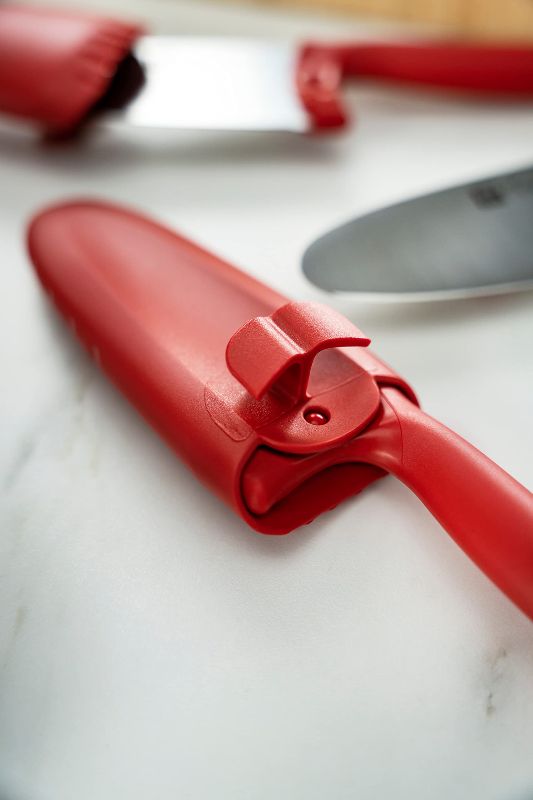 Zwilling Twinny red plastic handle provides secure, non-slip grip.