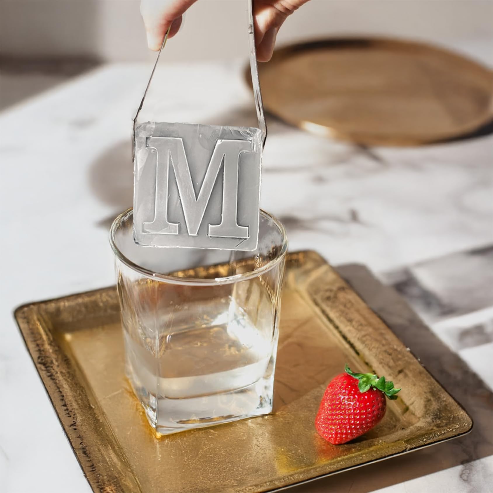 ZXYJJN two-inch whiskey ice cube tray creates slow-melting cubes for premium cocktails