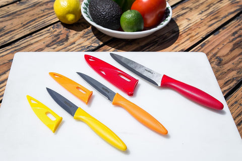 Zyliss knives slicing through meat, vegetables, and fruit with ease